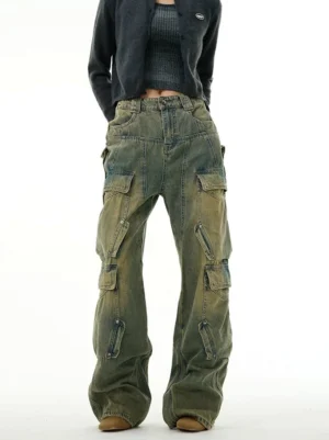 Full front view of vintage blue cargo wide-leg jeans featuring faded denim, zip-accented side pockets, and a high-waist streetwear silhouette