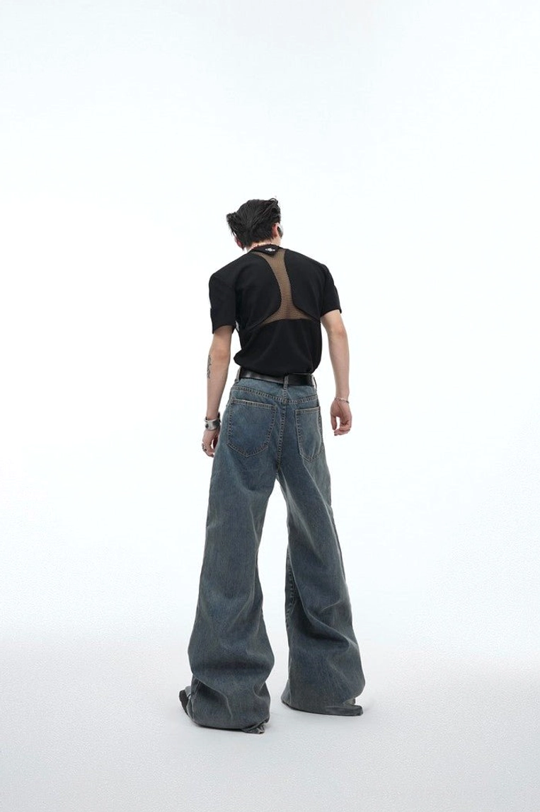 Back view of vintage washed blue relaxed fit wide leg jeans with classic rear pockets and clean denim construction