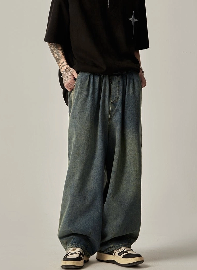 Front view of vintage blue washed wide-leg denim jeans with drawstring waist and relaxed Korean fashion fit