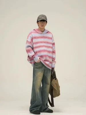 Vintage blue wide-leg denim jeans styled with a striped hooded knit sweater, baseball cap, and canvas crossbody bag in Seoul streetwear style