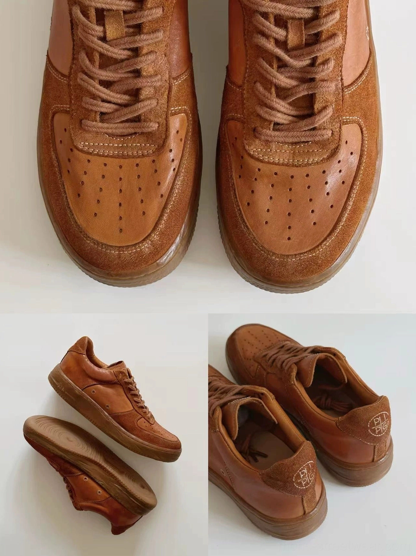Top view of vintage brown distressed leather low-top sneakers showing perforated toe boxes and metal lace details