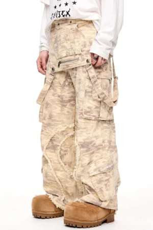 Vintage desert camo wide-leg cargo pants side view showing utility pockets and frayed distressed seam details