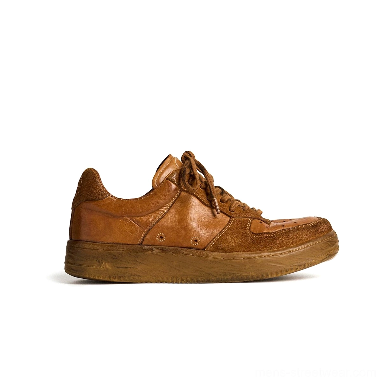 Handheld vintage distressed brown horsehide leather low-top sneaker with thick aged rubber sole and tonal laces