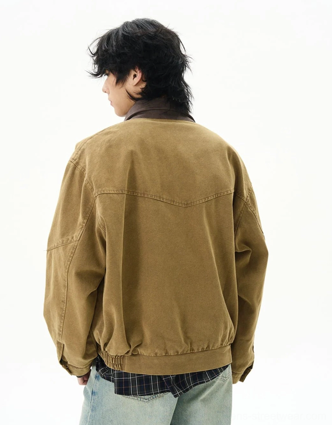 Back view of camel vintage duck canvas work jacket with rear yoke seam and elasticated hem