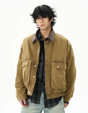 Camel vintage duck canvas work jacket with brown corduroy collar worn by male model in front studio view