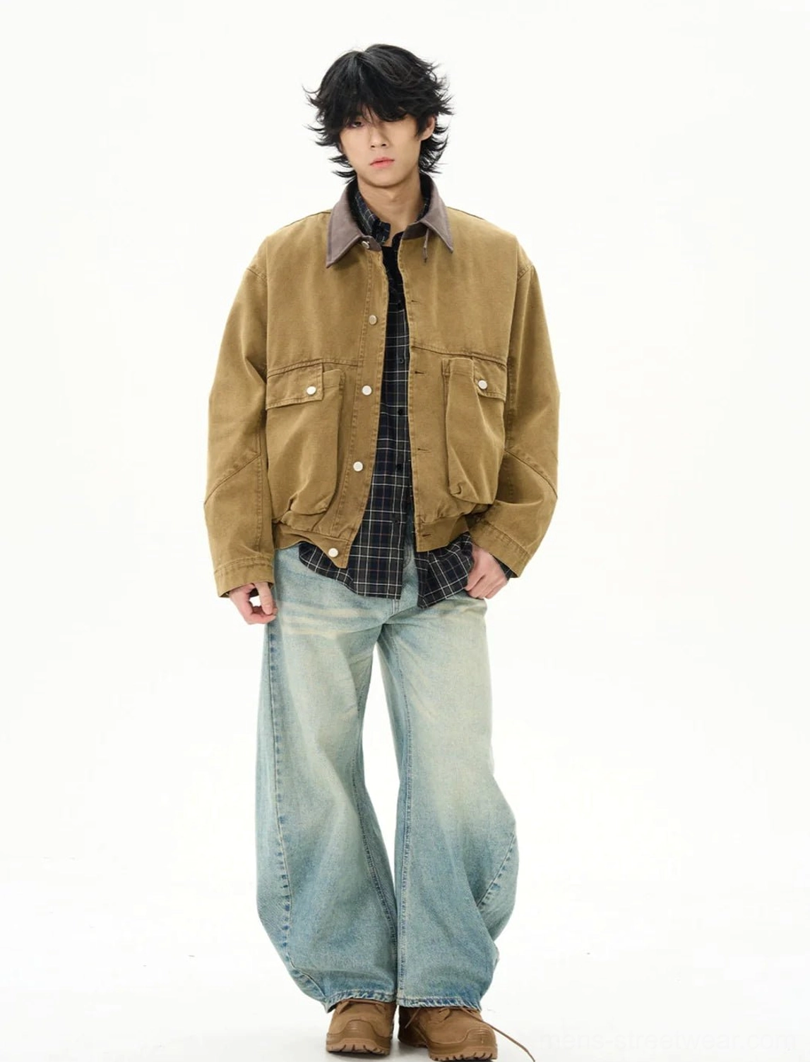 Full outfit view of camel duck canvas work jacket styled with plaid shirt wide leg jeans and leather shoes