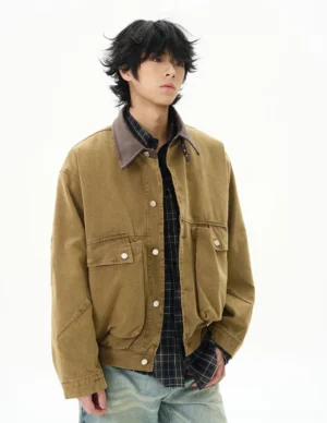 Camel vintage duck canvas work jacket in left three-quarter view showing relaxed dropped shoulder streetwear fit