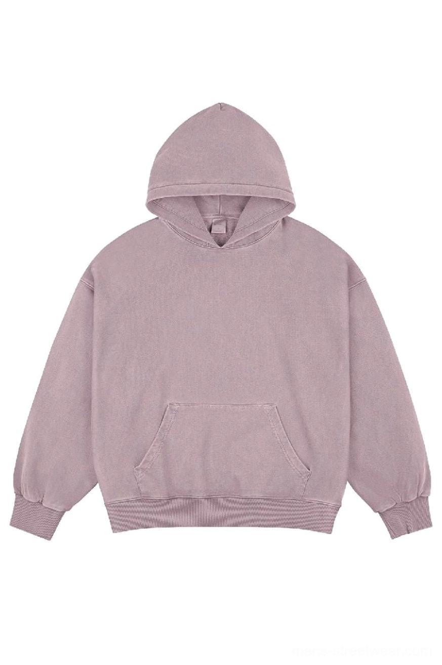 Dusty pink vintage faded wash oversized cotton hoodie front view with kangaroo pocket and ribbed details
