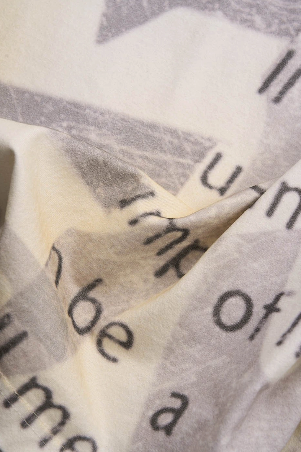 Vintage graffiti text oversized T-shirt product image in faded cream Korean streetwear style