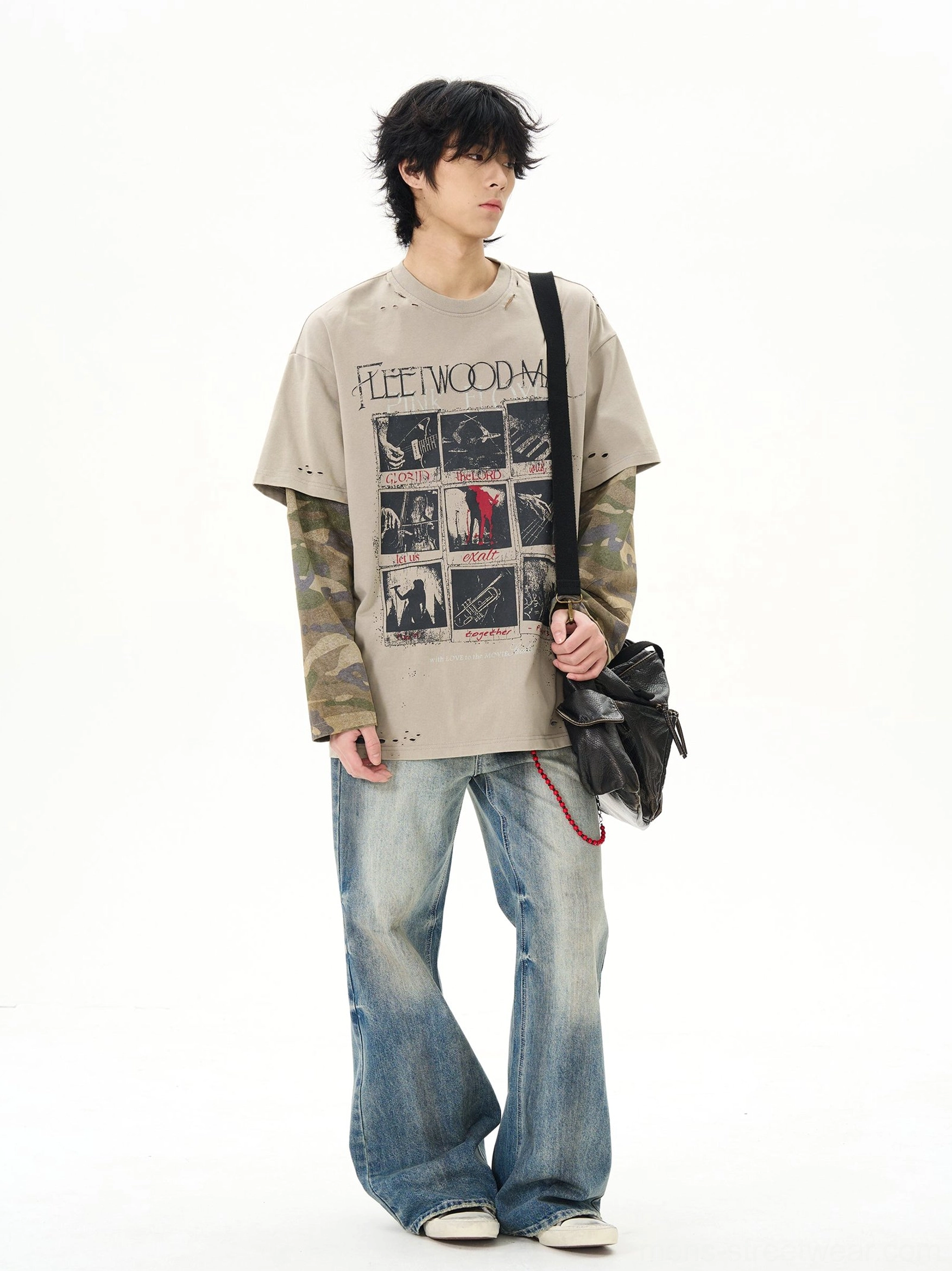 Three quarter front view of khaki camo layered sleeve graphic t-shirt styled with flared blue jeans and black crossbody bag