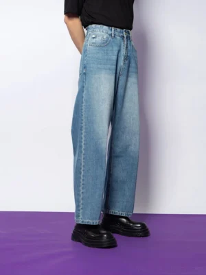 Side view of light washed blue straight-leg denim jeans showing the relaxed fit, full-length leg, and clean side seam