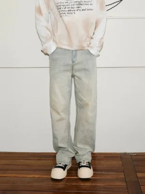 Front view of vintage mud-wash straight-leg jeans with a faded yellow clay denim finish in a relaxed Korean streetwear silhouette
