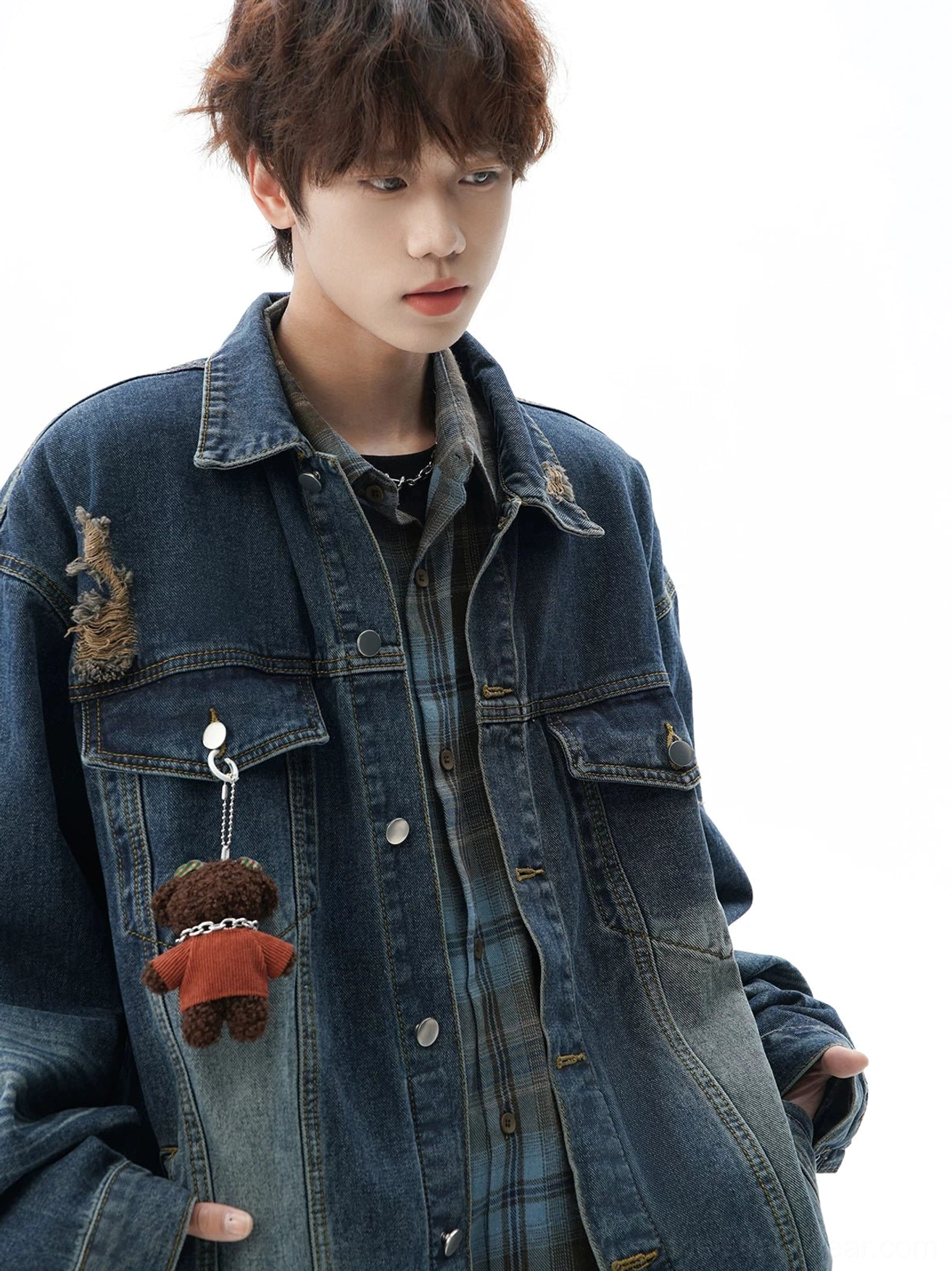 Vintage oversized denim jacket featuring distressed patches, contrasting faded wash, flap chest pockets, and versatile layered streetwear style