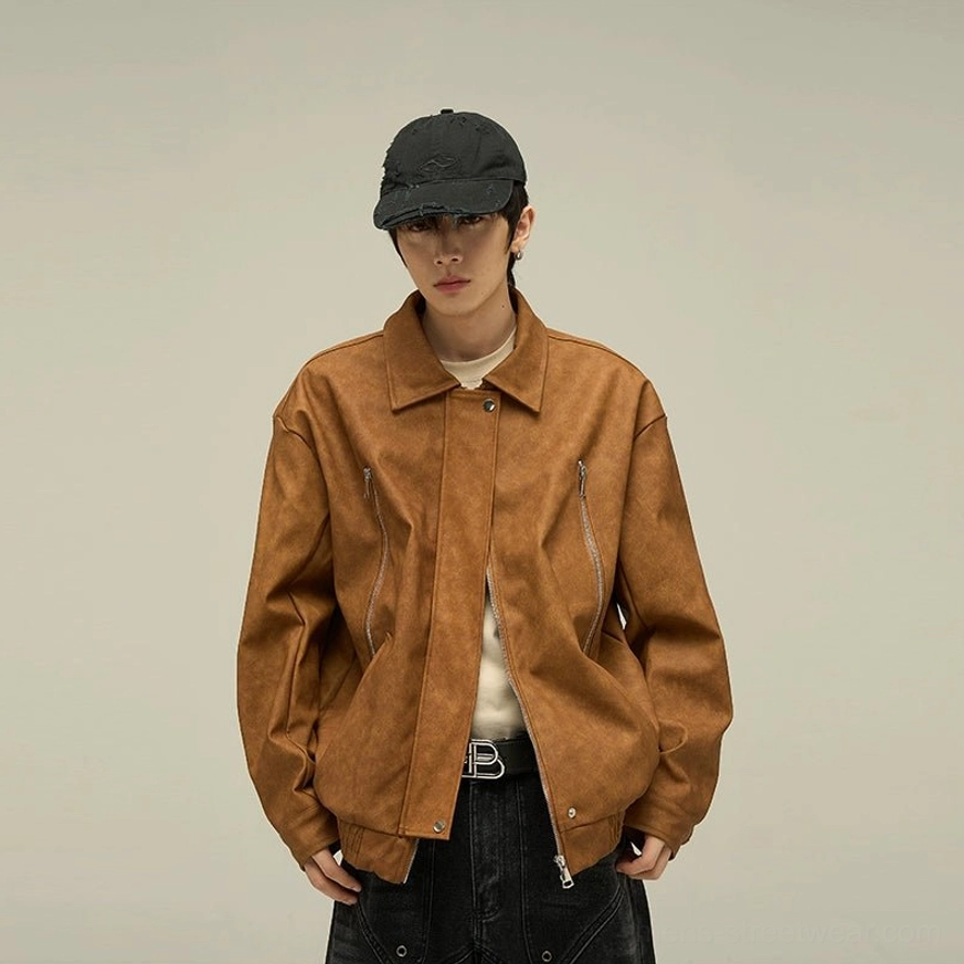 Vintage-inspired oversized vegan leather jacket with relaxed streetwear proportions, subtle texture, adjustable hem, and versatile urban styling