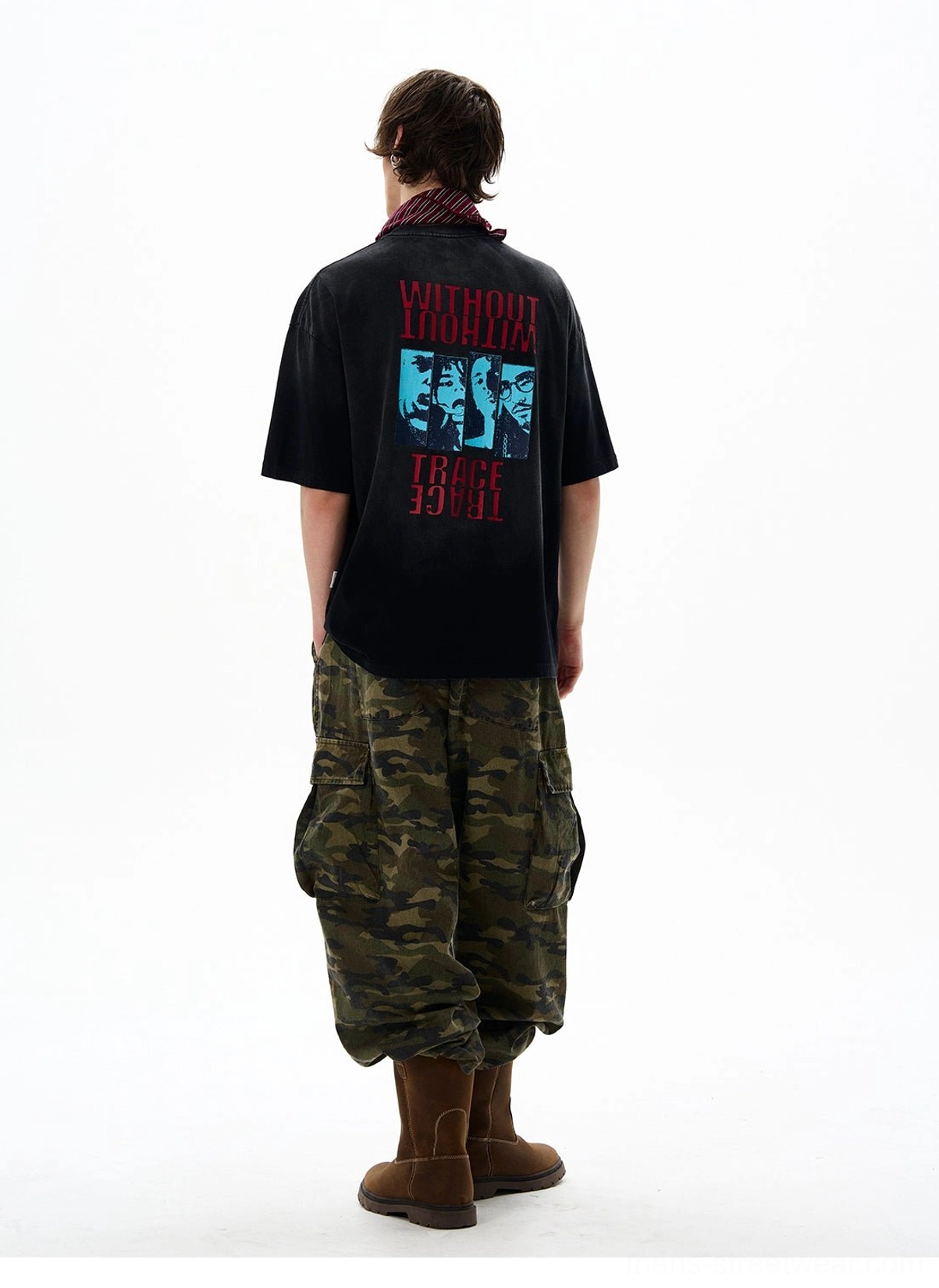Black oversized streetwear graphic t-shirt back view with blue portrait artwork and statement text