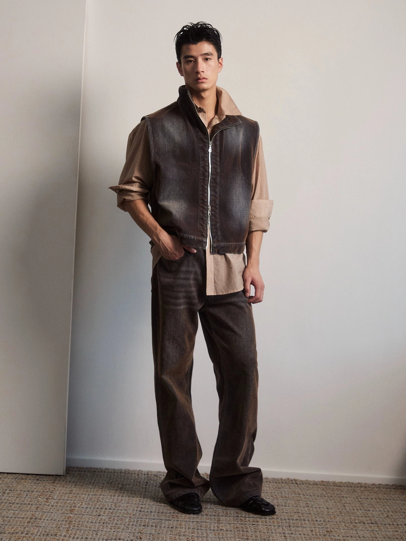 Vintage rust brown wide flare jeans front view showing faded denim wash and long stacked leg silhouette