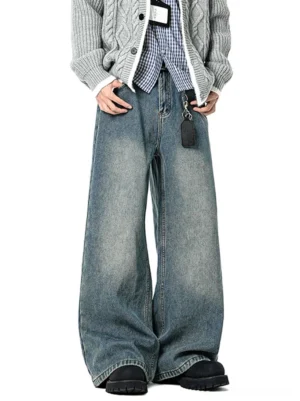 Vintage washed blue barrel-leg wide jeans styled with a gray cable knit cardigan, plaid shirt, and black platform leather shoes