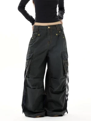 Dark gray vintage wash wide leg strap cargo jeans front lower body view with oversized cargo pockets and side drawcords