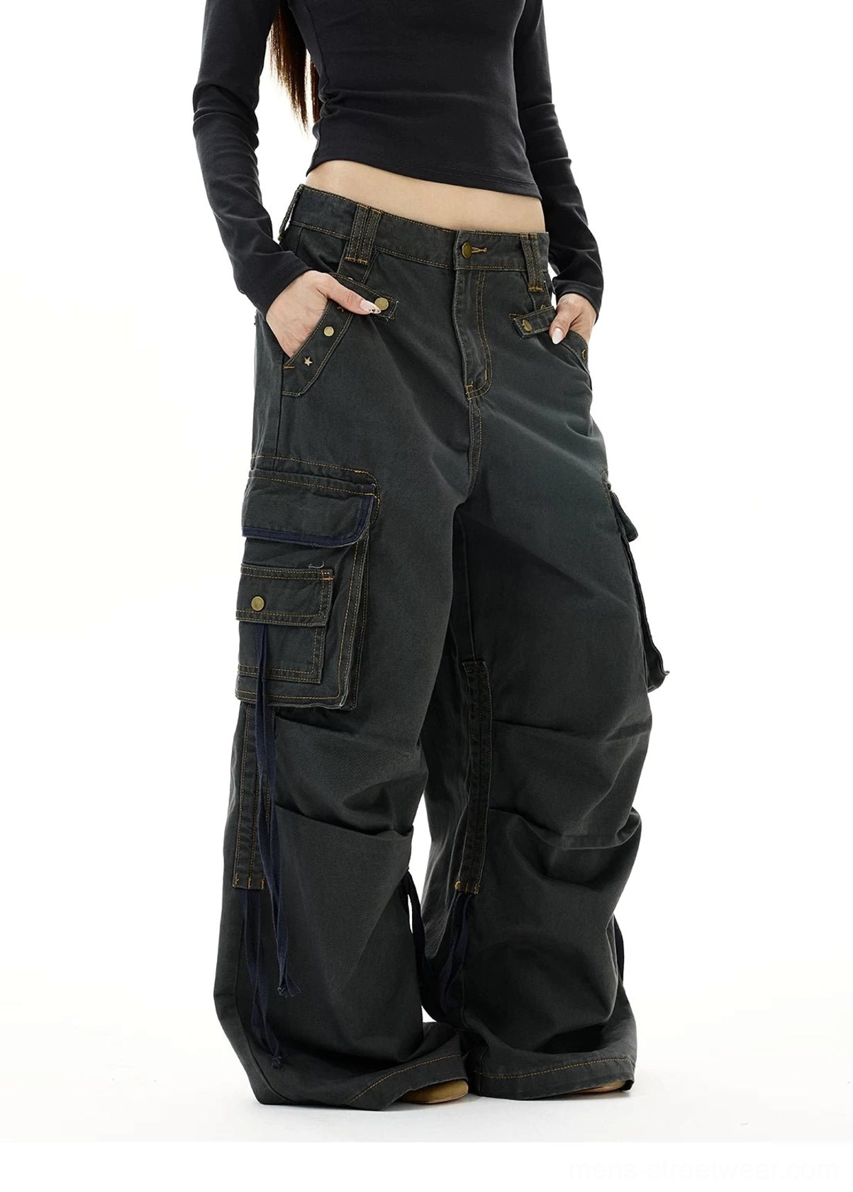 Dark gray low rise wide leg strap cargo jeans with side drawstrings and relaxed Y2K streetwear silhouette