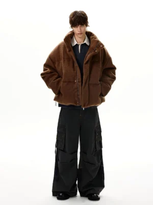 Dark gray wide leg strap cargo jeans styled with a brown shearling coat and black loafers in a Y2K streetwear outfit