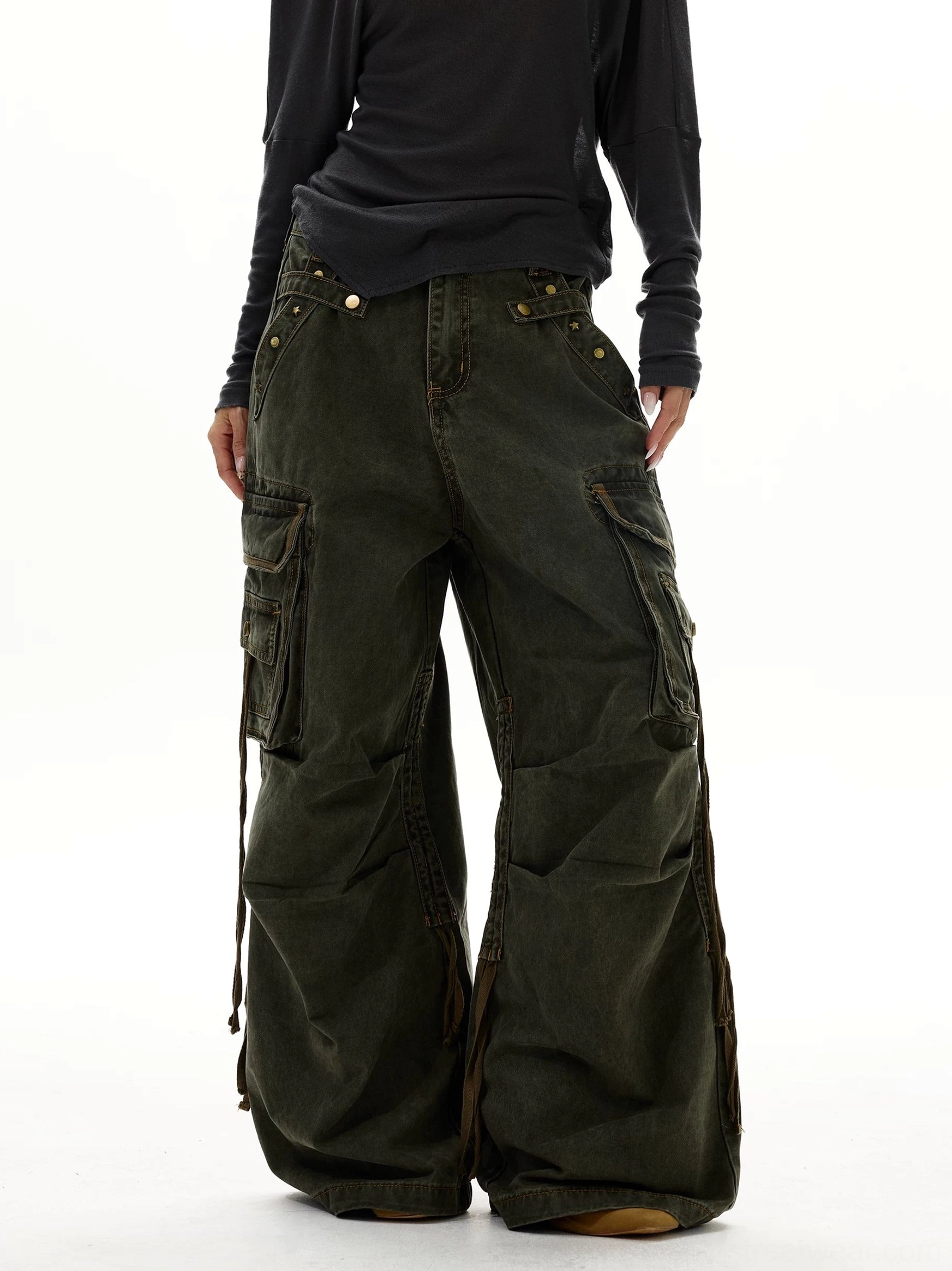 Vintage army green wide leg strap cargo jeans front side view with washed denim texture and brass-tone hardware