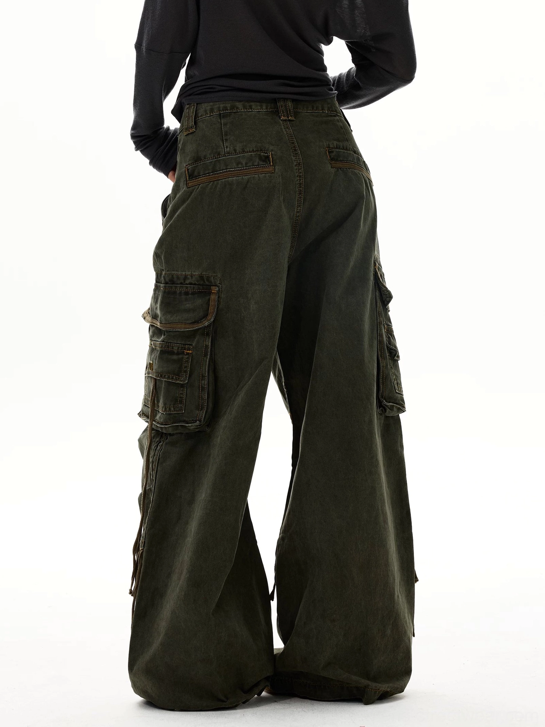 Army green oversized wide leg cargo jeans back view featuring flap pockets, brass buttons, and vintage washed finish