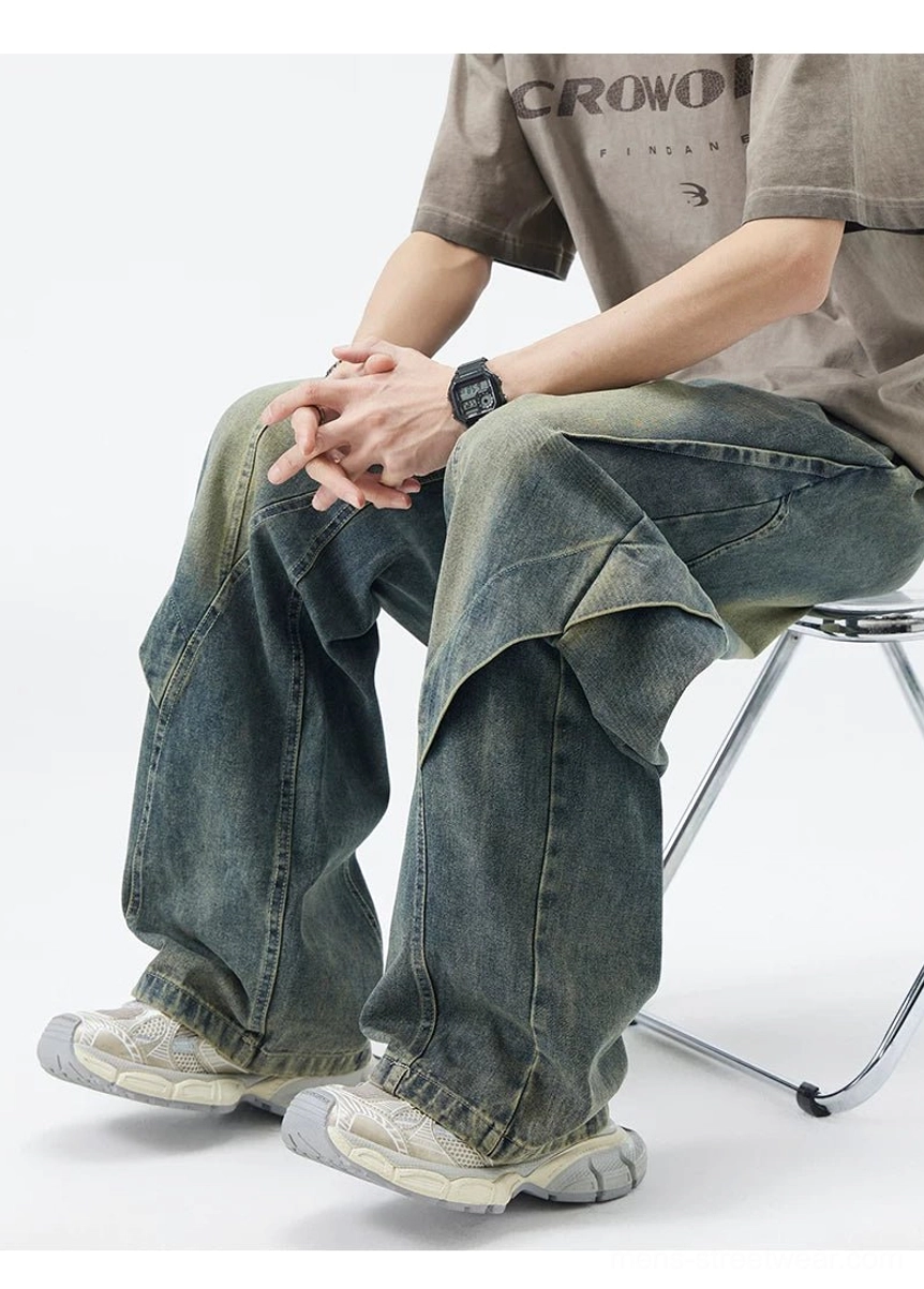 Vintage washed blue baggy paneled jeans seated view showing relaxed drape and extra-wide leg fit