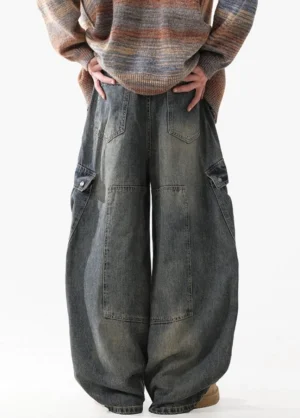 Back view of blue vintage washed cargo jeans showing relaxed wide legs, rear patch pockets, and classic denim streetwear styling