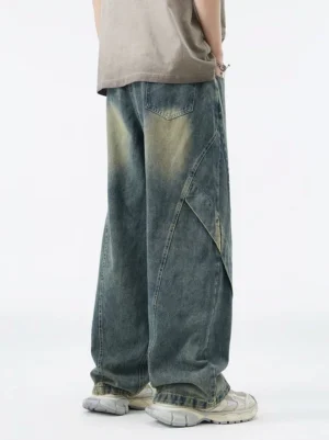 Vintage washed blue wide-leg jeans back view showing relaxed baggy fit rear pockets and diagonal panel seams