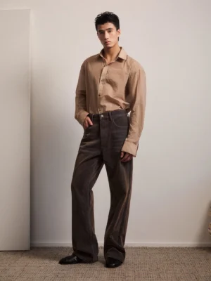 Vintage washed brown high rise flare jeans front full body view with relaxed wide leg streetwear silhouette