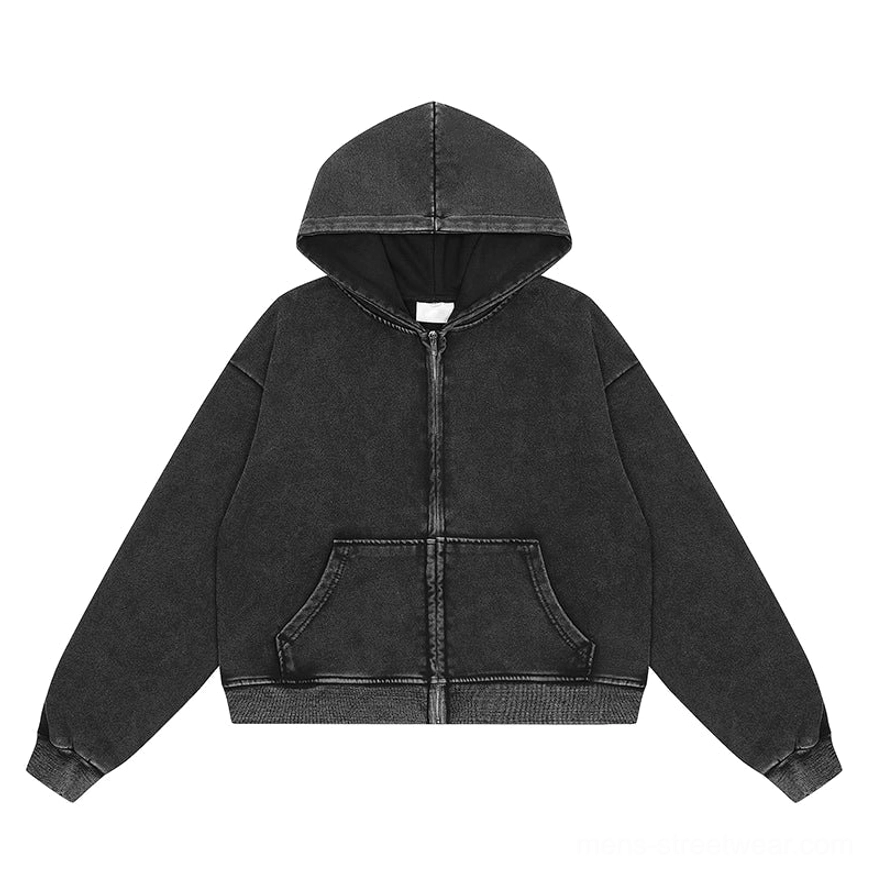 Flat lay of faded charcoal black vintage washed zip-up hoodie with full front zipper kangaroo pocket ribbed cuffs and ribbed hem