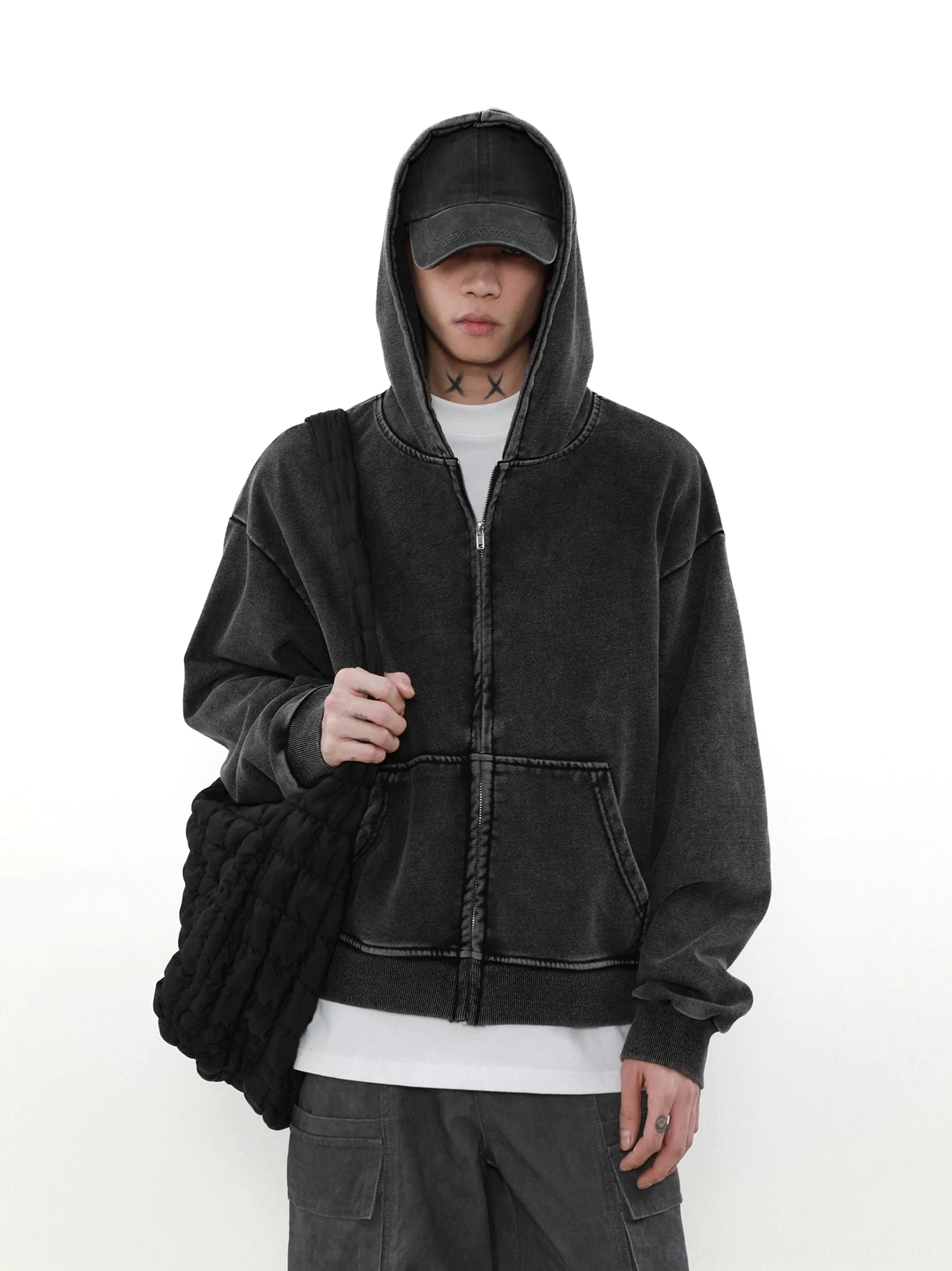 Faded charcoal vintage zip-up hoodie front view showing full zipper contrast seams kangaroo pocket and relaxed streetwear fit