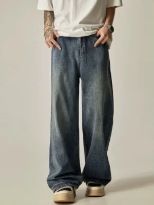 Vintage blue washed straight-leg jeans front full view showing relaxed long denim drape and loose streetwear silhouette
