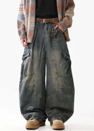 Front full-body view of vintage washed wide-leg cargo jeans with oversized utility pockets and a relaxed baggy streetwear silhouette