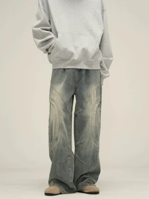 Front full-body view of vintage washed blue wide-leg jeans with curved panel stitching and a relaxed streetwear silhouette