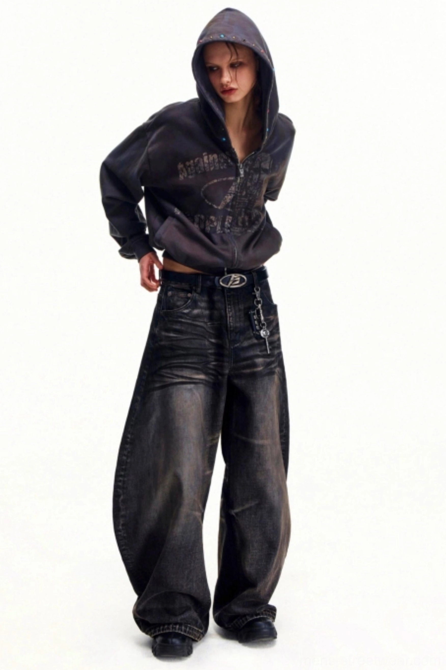 Vintage washed wide leg streetwear jeans styled with graphic zip hoodie and hanging belt accessory