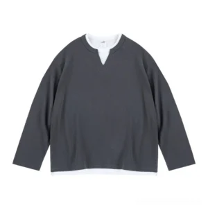 Dark gray waffle knit layered long sleeve tee shown in a flat lay front view with notch V-neck and white mock layered hem