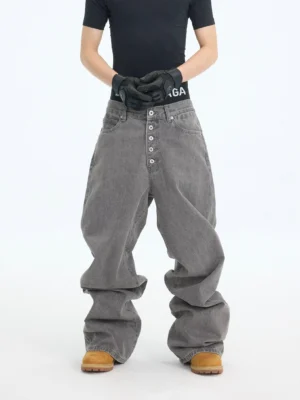 Front view of washed ash wide-leg stacked jeans with five-button fly, oversized streetwear fit, and relaxed workwear styling