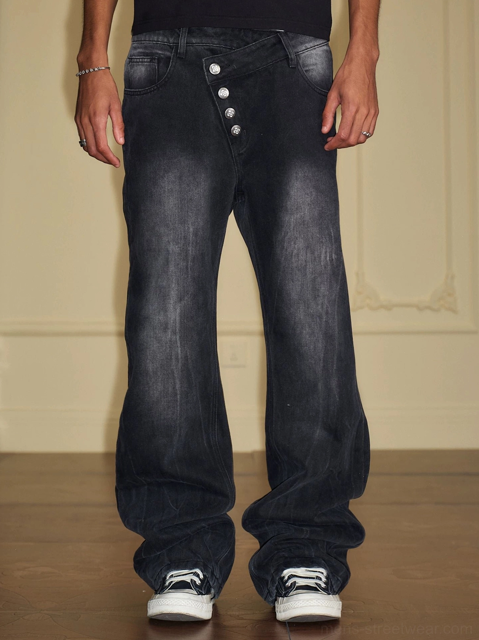 Washed black asymmetric multi-button waist wide-leg baggy jeans front view with streetwear styling