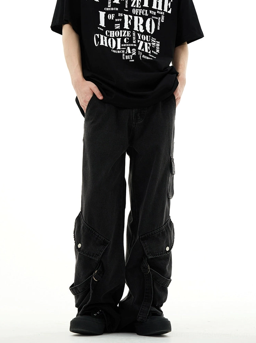 Front view of washed black wide-leg cargo denim jeans with symmetrical side pockets and relaxed streetwear fit