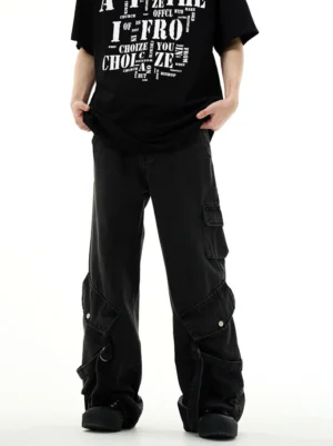 Washed black cargo wide-leg workwear denim jeans front view styled with graphic black T-shirt in streetwear studio look