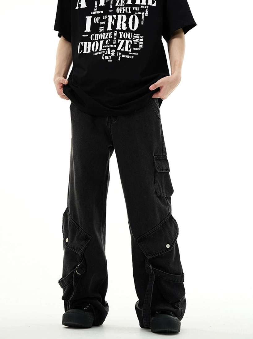 Washed black cargo wide-leg workwear denim jeans front view styled with graphic black T-shirt in streetwear studio look