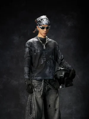Black washed grunge long sleeve graphic streetwear tee shown from the front on a punk biker model in a dark studio