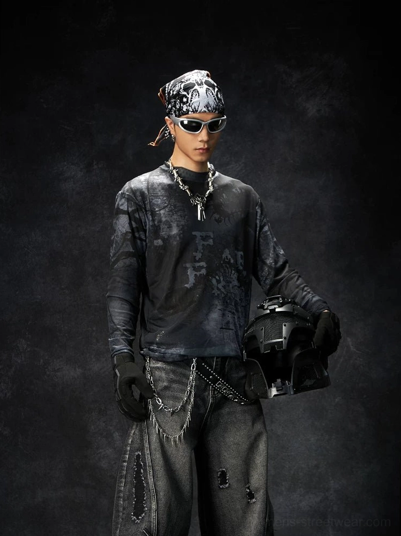 Black washed grunge long sleeve graphic streetwear tee shown from the front on a punk biker model in a dark studio
