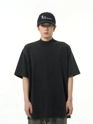 Washed black oversized high neck short sleeve streetwear T-shirt shown from the front on a male model