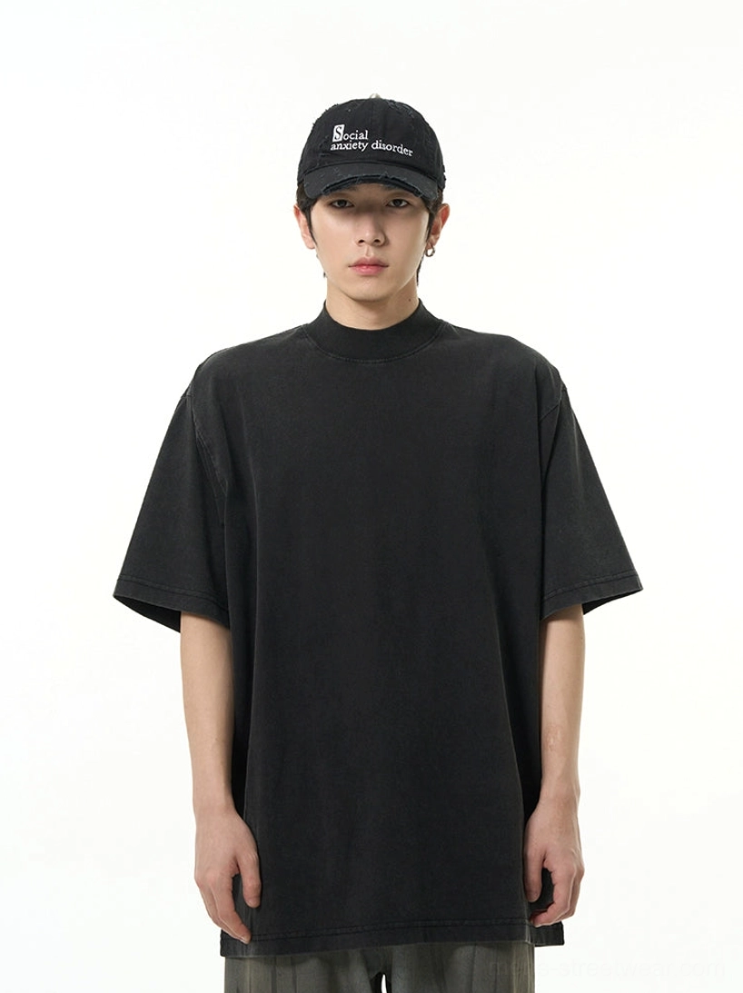 Washed black oversized high neck short sleeve streetwear T-shirt shown from the front on a male model