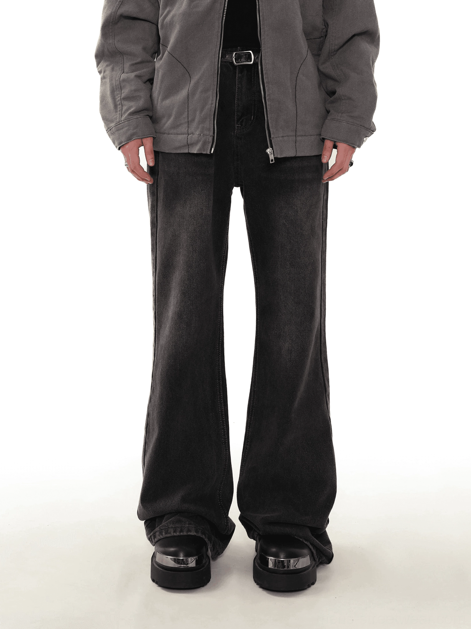 Front view of men's washed black flared denim jeans with five-pocket construction, belt loops, and wide leg streetwear silhouette