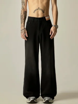 Washed black wide-leg relaxed fit denim jeans for men front close-up with loose streetwear silhouette