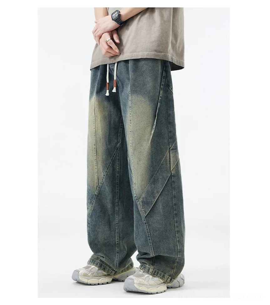 Washed blue drawstring waist paneled wide-leg jeans front view with loose Y2K streetwear silhouette