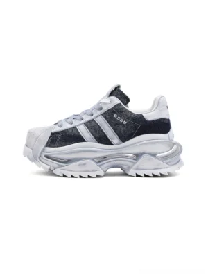 Washed blue genuine leather platform court sneaker shown in a left side studio view with layered stripe panels, white shell toe, padded collar, and chunky sculpted outsole